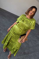 Thumbnail for caption_Model wears Lime Safari Erin Dress  in UK size 18/ US 14